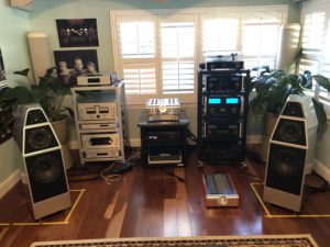 Wilson Audio "Yvette" speakers with all the gear in racks at a distance